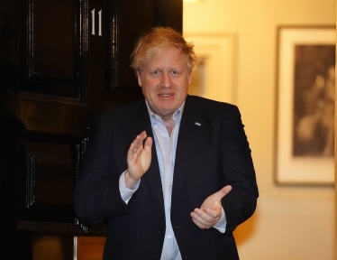 Boris Johnson clapping for carers.